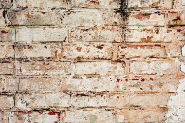 Texture of a brick wall with cracks and scratches which can be used as a background