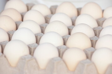 Crate with domestic poultry eggs. Crate of chicken eggs close up. Healthy eating.