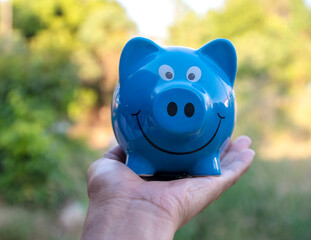 piggy bank in hand