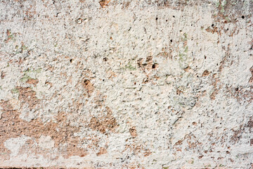 Texture of a concrete wall with cracks and scratches which can be used as a background