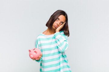 young hispanic woman feeling bored, frustrated and sleepy after a tiresome, dull and tedious task,...