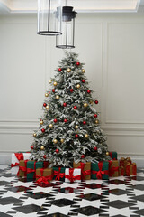Beautiful decorated christmas tree with present boxes.