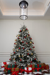 Beautiful decorated christmas tree with present boxes.