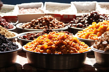 Dried fruits for sale on stall at farmers market. Apricots, figs and other dried fruits for sale at...