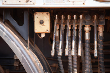 Control panel levers for lifting operation of mobile crane truck. Close-up and selective focus at lever's handle. Industrial object photo.