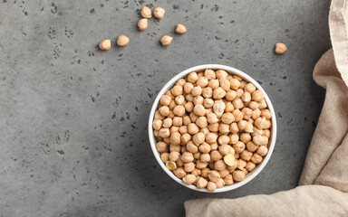 Raw chickpeas in a wooden bowl. Superfood. Copy space.