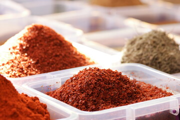 Spices at traditional turkish bazaar. Oriental market display with colorful seasonings.