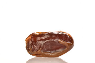 Several dried dates, close-up, isolated on white.