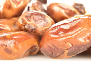 Several natural dried dates, close-up.