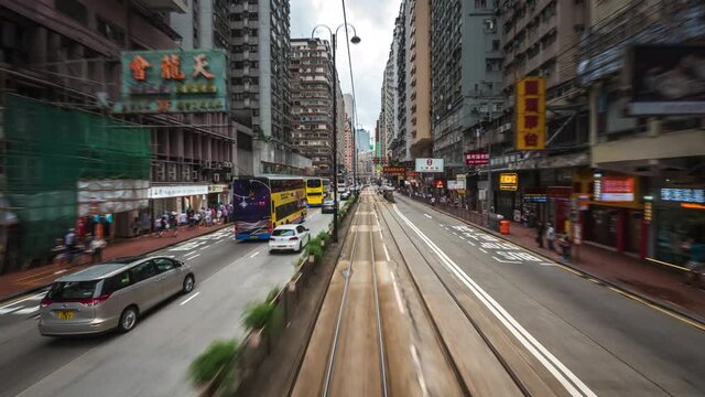 Motion time lapse view of tram ride around central Hong Kong, China, one of the most modern and densely populated cities in the world. - Powered by Adobe