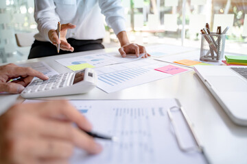 Business Startup team discussing on data report documents at modern workplace..