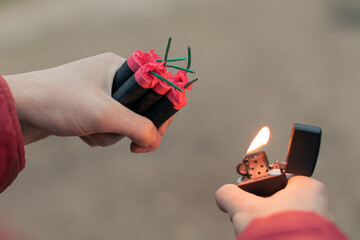 Man Lighting Up Several Firecrackers in his Hand Using Gasoline Lighter. Guy Getting Ready for New...