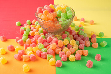 Gummy candy, arrangement of gummy candy seen from above in a glass jar and spread on the table on a...