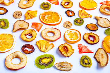 Organic Healthy Assorted Dried Fruit Mix close up. Dried fruit snacks. dried apples, mango, feijoa, dried apricots, prunes top view