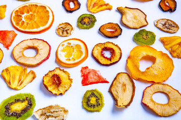 Organic Healthy Assorted Dried Fruit Mix close up. Dried fruit snacks. dried apples, mango, feijoa, dried apricots, prunes top view
