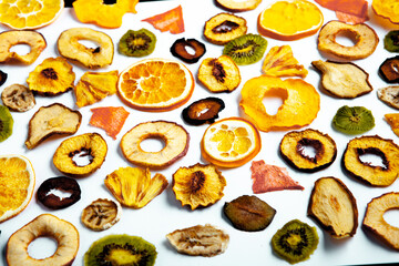 Organic Healthy Assorted Dried Fruit Mix close up. Dried fruit snacks. dried apples, mango, feijoa, dried apricots, prunes top view