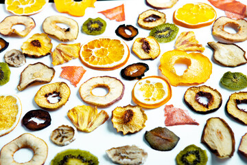 Organic Healthy Assorted Dried Fruit Mix close up. Dried fruit snacks. dried apples, mango, feijoa, dried apricots, prunes top view