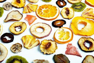 Organic Healthy Assorted Dried Fruit Mix close up. Dried fruit snacks. dried apples, mango, feijoa, dried apricots, prunes top view