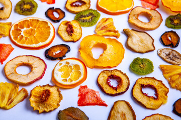 Organic Healthy Assorted Dried Fruit Mix close up. Dried fruit snacks. dried apples, mango, feijoa, dried apricots, prunes top view