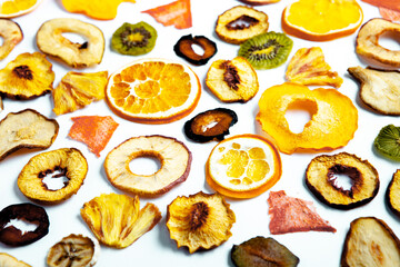 Organic Healthy Assorted Dried Fruit Mix close up. Dried fruit snacks. dried apples, mango, feijoa, dried apricots, prunes top view