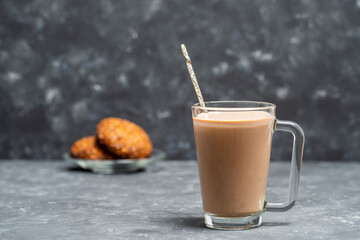 Hot cocoa drink and oatmeal cookies on the table.
