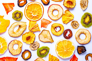 Organic Healthy Assorted Dried Fruit Mix close up. Dried fruit snacks. dried apples, mango, feijoa, dried apricots, prunes top view