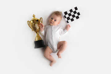 small baby with golden cup and checkered flag, starting small business concept