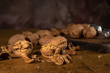Nut, arrangement with nuts on rustic wood, low key image, selective focus.