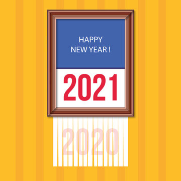 concept pour une carte de vœux originale, montrant un tableau dans un cadre, sur lequel est inscrit 2021 avec l’année 2019 qui disparaît passant dans une broyeuse.