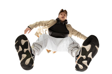 Skater. Young stylish man in modern street style outfit isolated on white background, shot from the...