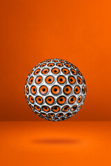 Speakers sphere on a orange studio background