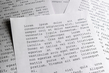 lorem ipsum dolor sit amet concept. selective focus photo of paper sheets with publishing and...