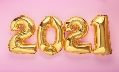 2021 year air balloon numbers on pink background. Happy New year eve invitation with Christmas gold foil balloons 2021. Flat lay long web banner