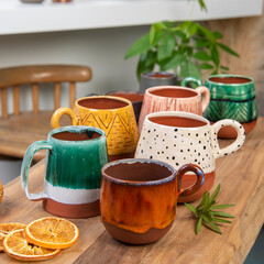 ceramic coffee mugs on wooden table