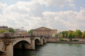 Fototapeta premium View of the National Assembly. On the waterfront are cars and pedestrians