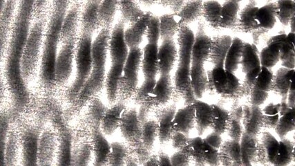 Oscillating serpentine and wave-train patterns in a liquid.