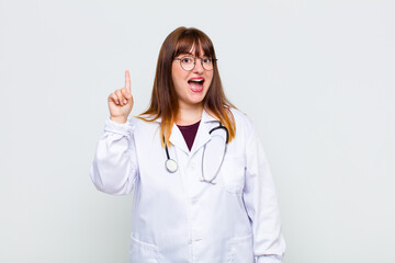 plus size woman feeling like a happy and excited genius after realizing an idea, cheerfully raising...