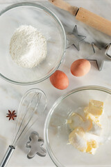 baking process, preparing ingredients: butter, sugar, flour, eggs, on marble surface,, flat lay, top view 
