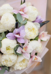 Flower composition. Macro photo. Wedding decor. A Beautiful bouquet of fresh peonies and tulips flowers.