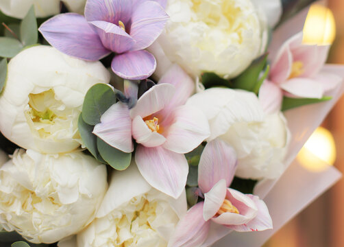 Flower composition. Macro photo. Wedding decor. A Beautiful bouquet of fresh peonies and tulips flowers.
