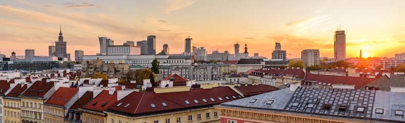 Cityscape of Warsaw. Roofs of the old town and skyscrapers against a beautiful sunset sky, Warsaw, Poland