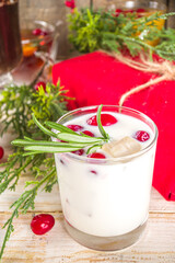 Set of different Christmas and winter drinks. An assortment of Christmas cocktails, hot and cold beverages, in cozy wooden home background with Xmas decor