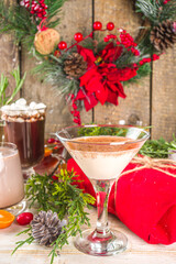Set of different Christmas and winter drinks. An assortment of Christmas cocktails, hot and cold beverages, in cozy wooden home background with Xmas decor