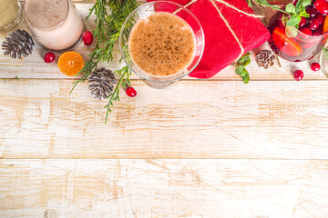 Set of different Christmas and winter drinks. An assortment of Christmas cocktails, hot and cold beverages, in cozy wooden home background with Xmas decor
