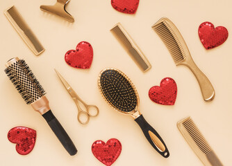 Obraz na płótnie Canvas Valentines day background with hairdressing tools and hearts. Gold hair salon accessories.