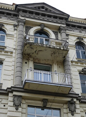 Facade of an old building with a balcony