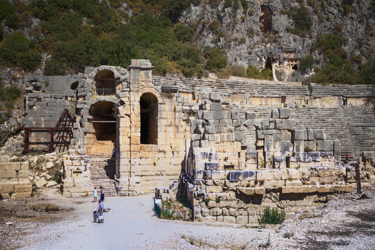  The ancient Greco-Roman theater in Lycian city.Tourists visiting the theater and taking pictures