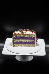Delicious cake in a confectionery on a dark background