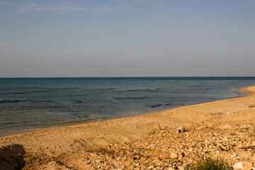 Beautiful empty beach. Seascape  with clear sky and tranquil water. Winter in Middle East. 