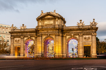 Puerta de Alcala in Madrid at sunset during Christmas